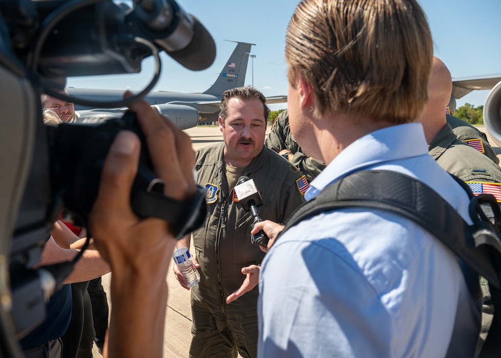 reporter interviews Air Force pilot