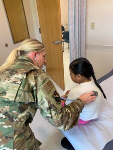 U.S. Air Force Capt. Kaitlyn Brenner, a physician assistant assigned to the 148th Fighter Wing, Minnesota Air National Guard, cares for a patient during an Innovative Readiness Training mission at Fort Belknap Indian Reservation, Montana, Aug. 9, 2024. The Department of Defense program provides free health care in underserved communities while increasing military readiness.