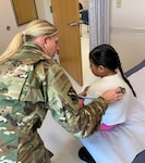 U.S. Air Force Capt. Kaitlyn Brenner, a physician assistant assigned to the 148th Fighter Wing, Minnesota Air National Guard, cares for a patient during an Innovative Readiness Training mission at Fort Belknap Indian Reservation, Montana, Aug. 9, 2024.