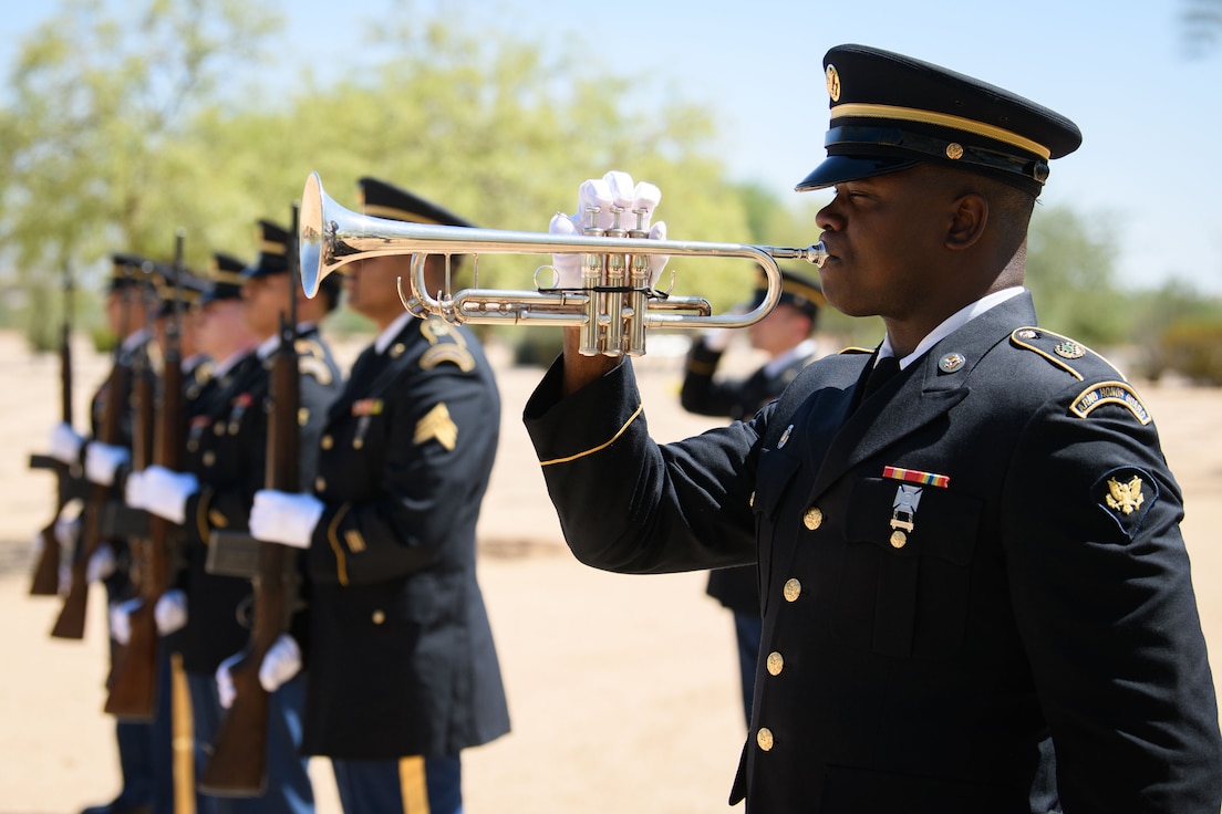 Soldiers of the Arizona National Guard Honor Guard stand at attention for the playing of TAPS during a full military honor's funeral for retired Brig. Gen. Walter J. Whitfield, Sept. 9, 2024.