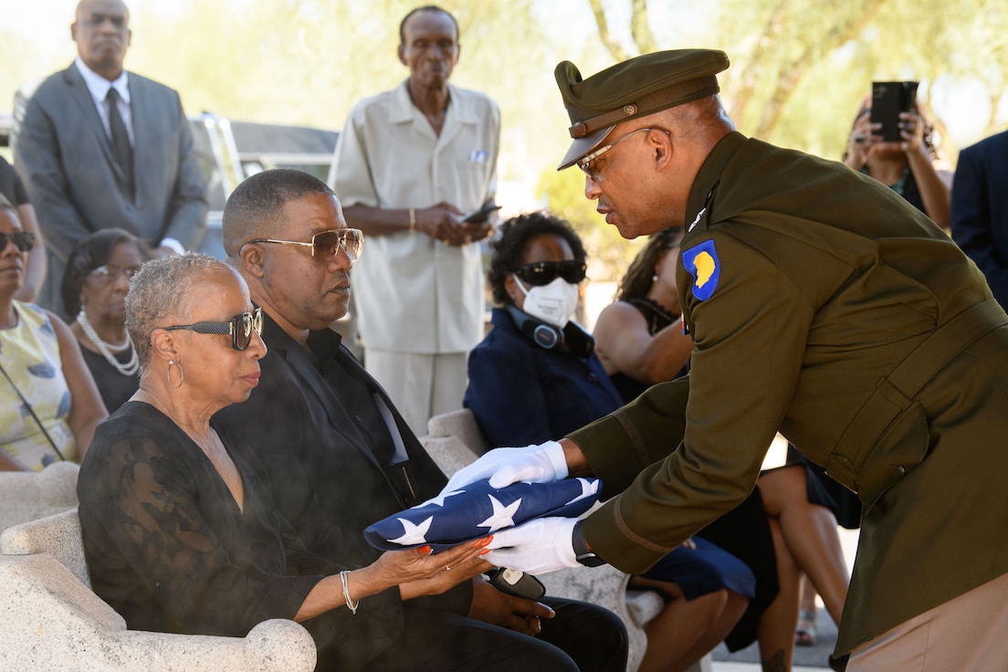 Major Gen. Rodney Boyd, Adjutant General of the State of Illinois presents the U.S. flag to Jackie Platt-Whitfield, window of retired Brig. Gen. Walter J. Whitfield, during a full military honor's funeral ceremony Sept. 9, 2024.