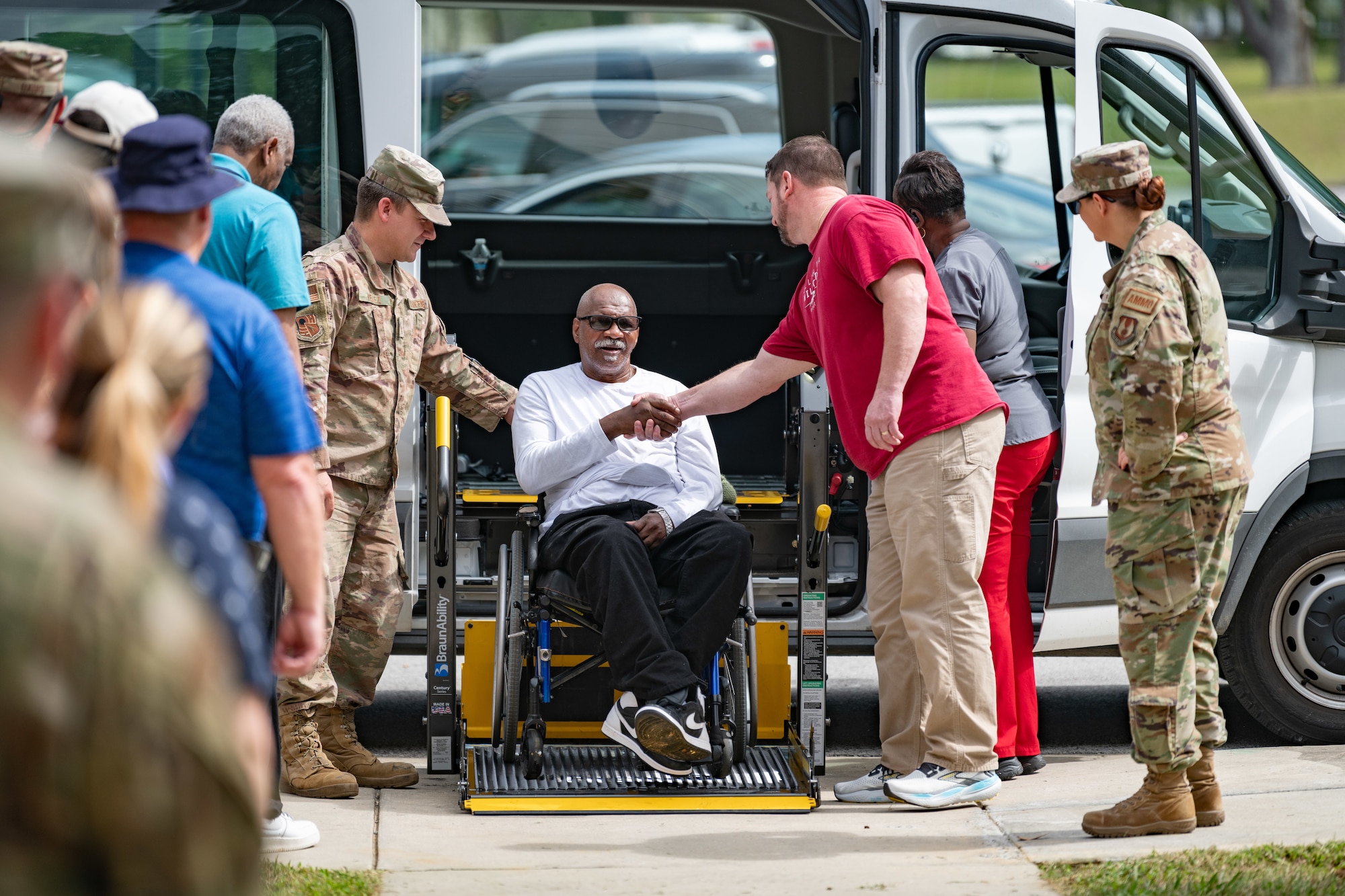 Veterans with the Tennessee State Veterans’ Homes and Veteran Affairs and Tennessee Valley Healthcare System receive a warm welcome of cheers and handshakes from Arnold Air Force Base personnel during the Veterans Appreciation Picnic Sept. 6, 2024, at the Arnold Lakeside Complex at Arnold Air Force Base, Tenn. (U.S. Air Force photo by Keith Thornburgh)