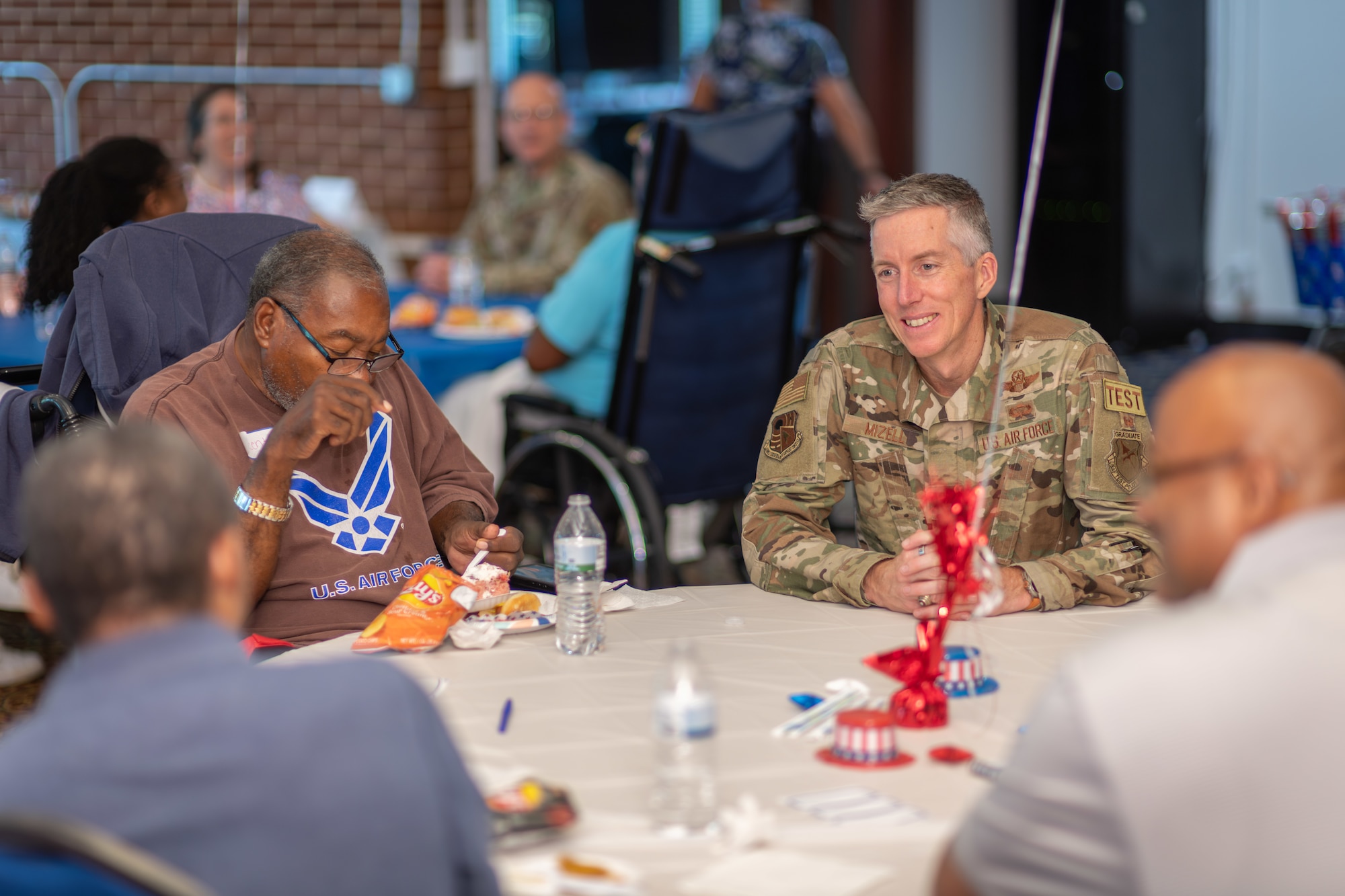 Col. Grant Mizell, Arnold Engineering Development Complex commander, speaks with veterans during the Veterans Appreciation Picnic Sept. 6, 2024, at the Arnold Lakeside Complex at Arnold Air Force Base, Tenn. (U.S. Air Force photo by Keith Thornburgh)