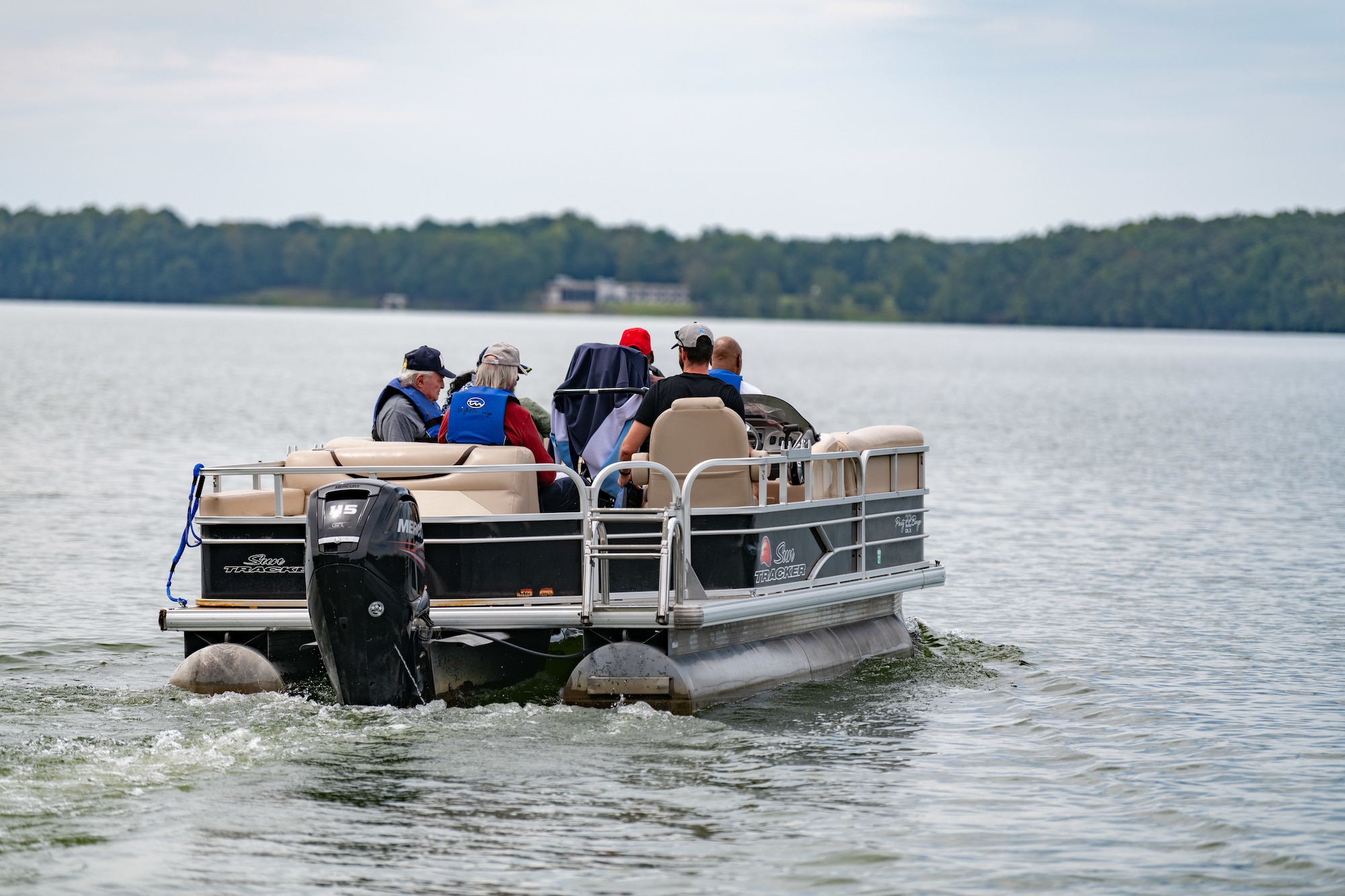 Veterans float along Woods Reservoir Sept. 6, 2024, at Arnold Lakeside Complex at Arnold Air Force Base, Tenn.  Pontoon rides were offered for those in attendance for the Veterans Appreciation Picnic. (U.S. Air Force photo by Keith Thornburgh)
