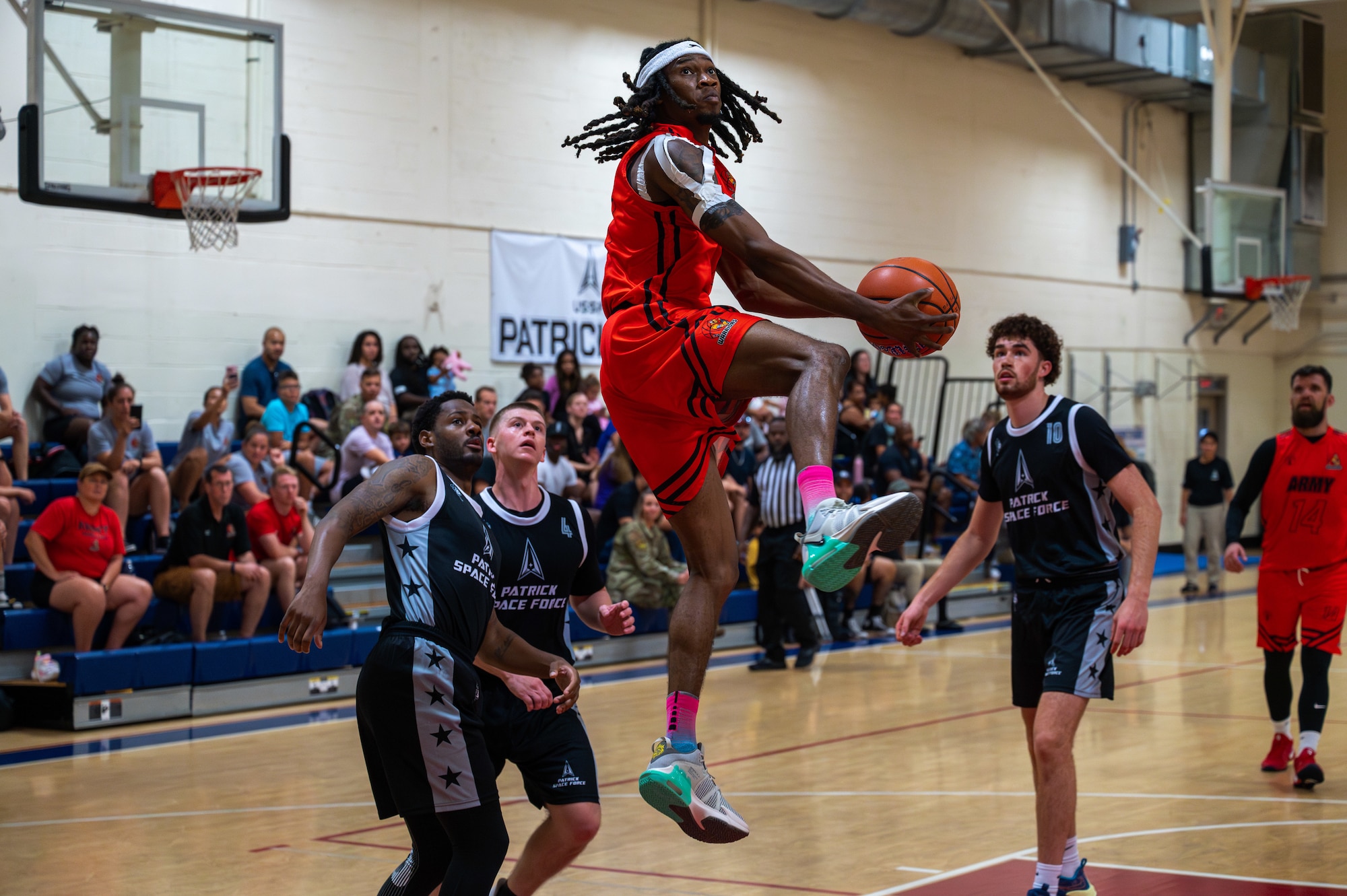 Two teams play in a basketball game.