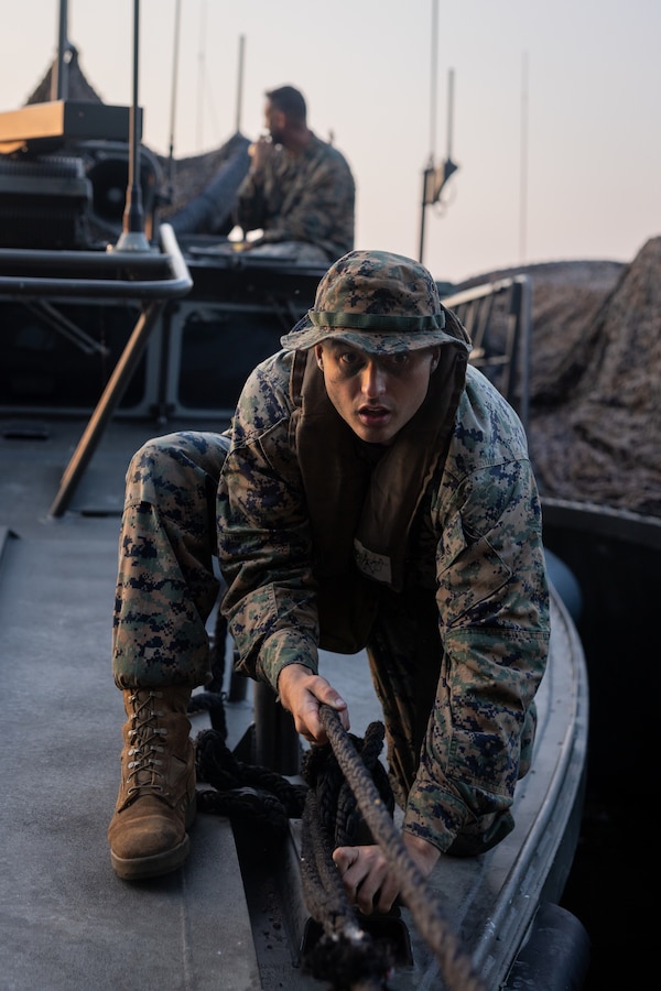 U.S. Marine Corps 1st Lt. Ryan Doolan, assault amphibious vehicle officer, secures a bow line of a CB90 combat boat in Sweden, September 7, 2024.The culminating event consisted of combined amphibious operations in and around the Swedish archipelagos. Marines assigned to 4th Assault Amphibian Battalion, 4th Marine Division, Marine Forces Reserve, deployed for training in support of Exercise Archipelago Endeavor, an annual integrated, Swedish Armed Forces-led exercise that increases operational capabilities between U.S. Marines and Swedish Forces. (U.S. Marine Corps photo by Sgt. Scott Jenkins)