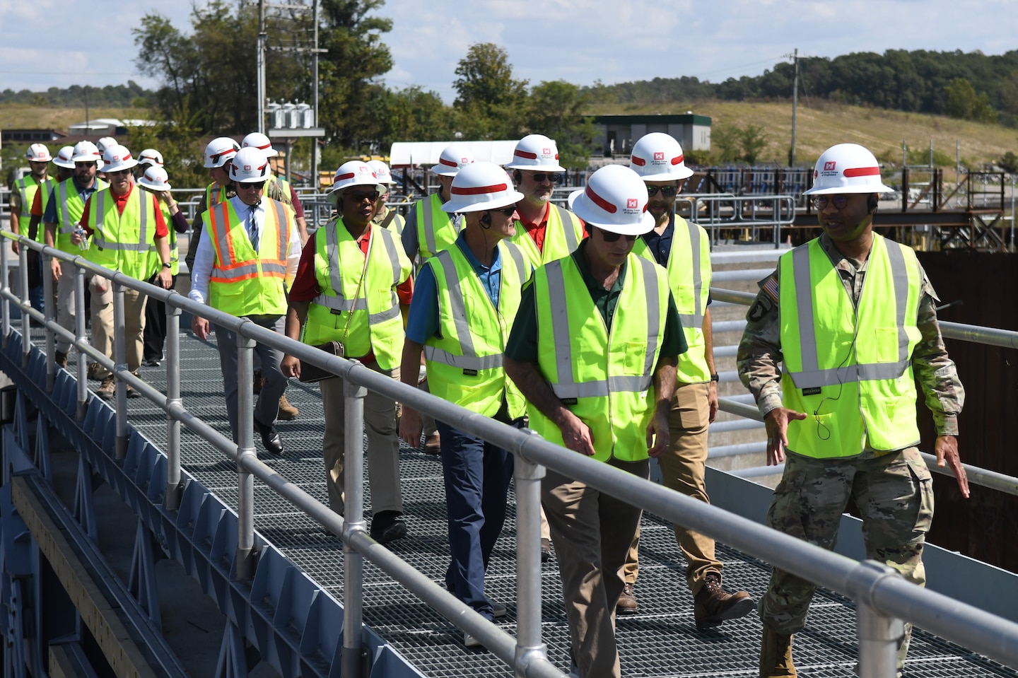 The U.S. Army Engineer Research and Development Center (ERDC) Board of Directors and U.S. Army Corps of Engineers Nashville District officials cross over the miter gates at the Kentucky Lock construction project during a tour on Sept. 23, 2024. The visit aimed to explore opportunities for innovation and collaboration at key USACE Nashville District projects.