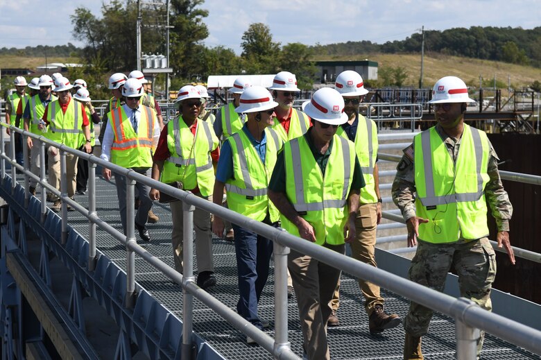 The U.S. Army Engineer Research and Development Center (ERDC) Board of Directors and U.S. Army Corps of Engineers Nashville District officials cross over the miter gates at the Kentucky Lock construction project during a tour on Sept. 23, 2024. The visit aimed to explore opportunities for innovation and collaboration at key USACE Nashville District projects.