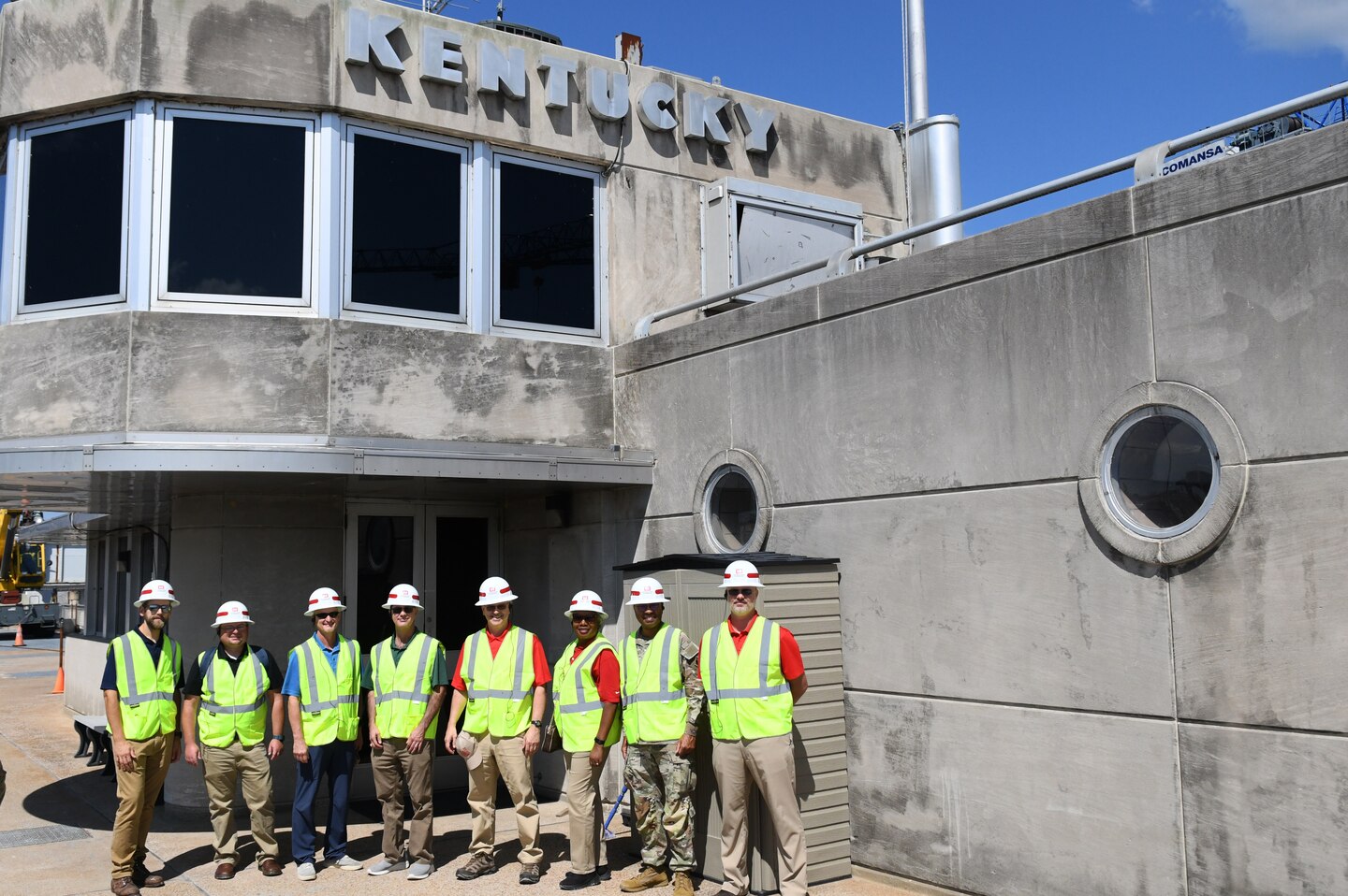 The U.S. Army Engineer Research and Development Center (ERDC) Board of Directors pose for a photo in front of the Kentucky Lock control center in Grand Rivers, Ky. during a visit on Sept. 23, 2024. The visit aimed to explore opportunities for innovation and collaboration at key USACE Nashville District projects.