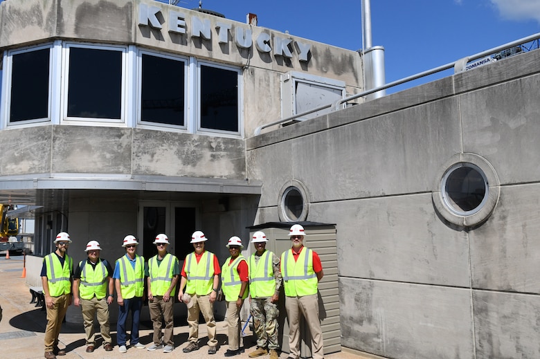 The U.S. Army Engineer Research and Development Center (ERDC) Board of Directors pose for a photo in front of the Kentucky Lock control center in Grand Rivers, Ky. during a visit on Sept. 23, 2024. The visit aimed to explore opportunities for innovation and collaboration at key USACE Nashville District projects.