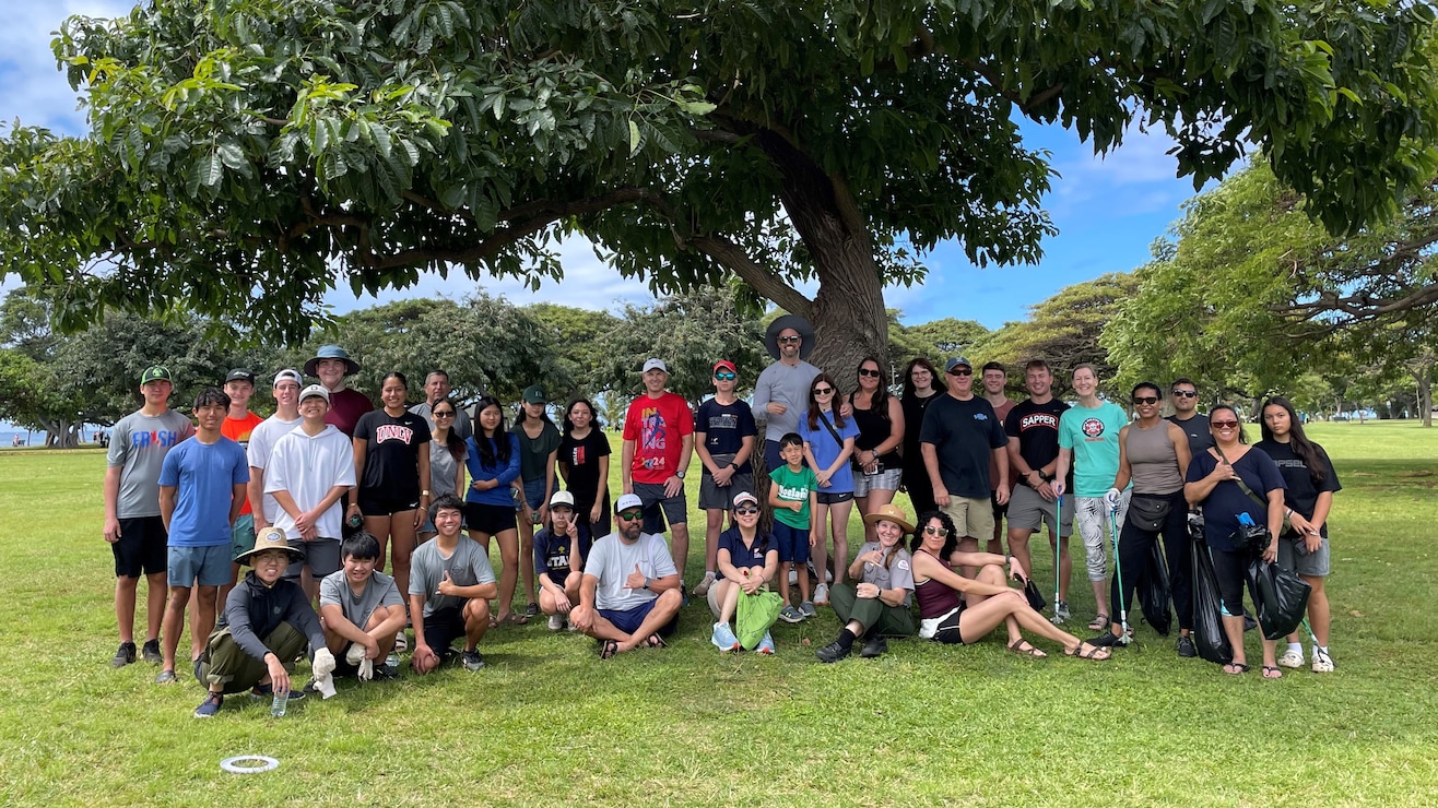 Members of the Honolulu District 'Ohana gather for a photo April 20, 2024 after completing a cleanup of Ala Moana Regional Park in Honolulu to commemorate Earth Day.