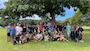 Members of the Honolulu District 'Ohana gather for a photo April 20, 2024 after completing a cleanup of Ala Moana Regional Park in Honolulu to commemorate Earth Day.