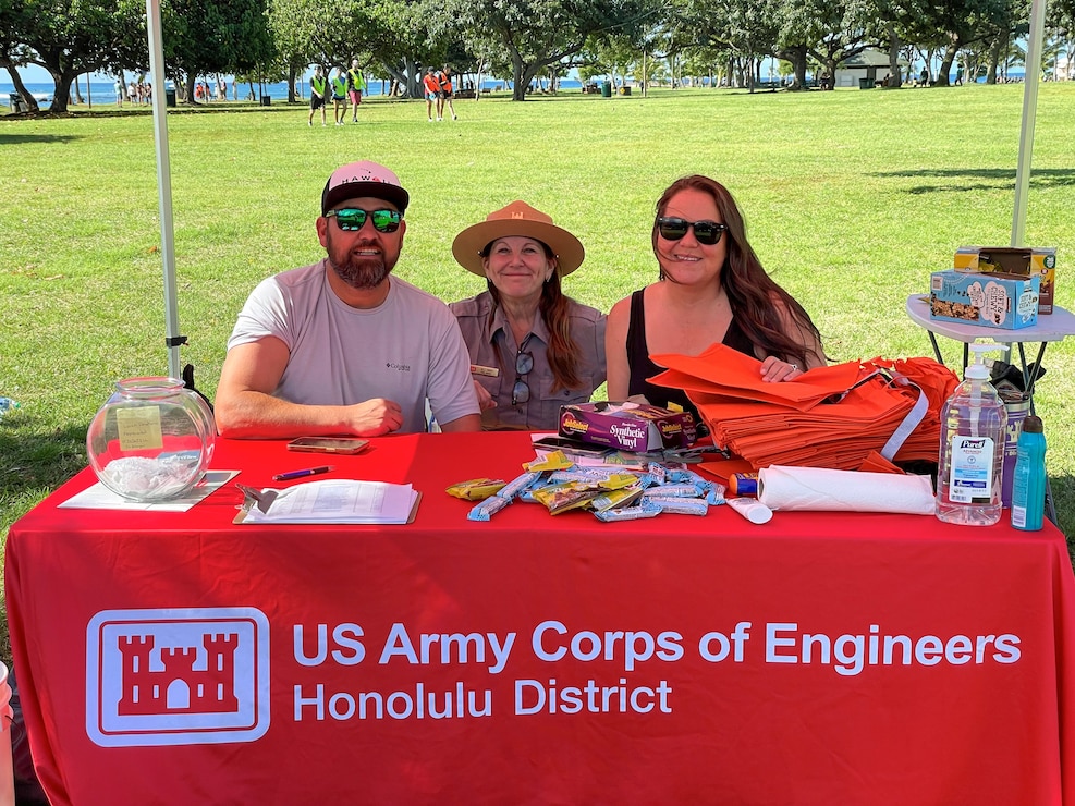 From left to right: Joshua Bruening, Jill Davis and Nikki Smith help behind the scenes with logistics, supplies and snacks during the Earth Day cleanup April 20, 2024 at Ala Moana Park.