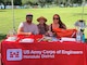 From left to right: Joshua Bruening, Jill Davis and Nikki Smith help behind the scenes with logistics, supplies and snacks during the Earth Day cleanup April 20, 2024 at Ala Moana Park.