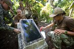 Sailors supporting Pacific Partnership preserve World War II memorial markers at multiple WWII crash sites on the Island of Yap.