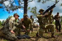 U.S. Army Spc. Caleb Lewis, a M249 Squad Automatic Rifle gunner with the Nevada Army National Guard’s 609th Engineer Company, instructs Australian soldiers on the functions of his weapon during Exercise Cartwheel 2024 in Fiji’s Nausori Highlands Sept. 12.