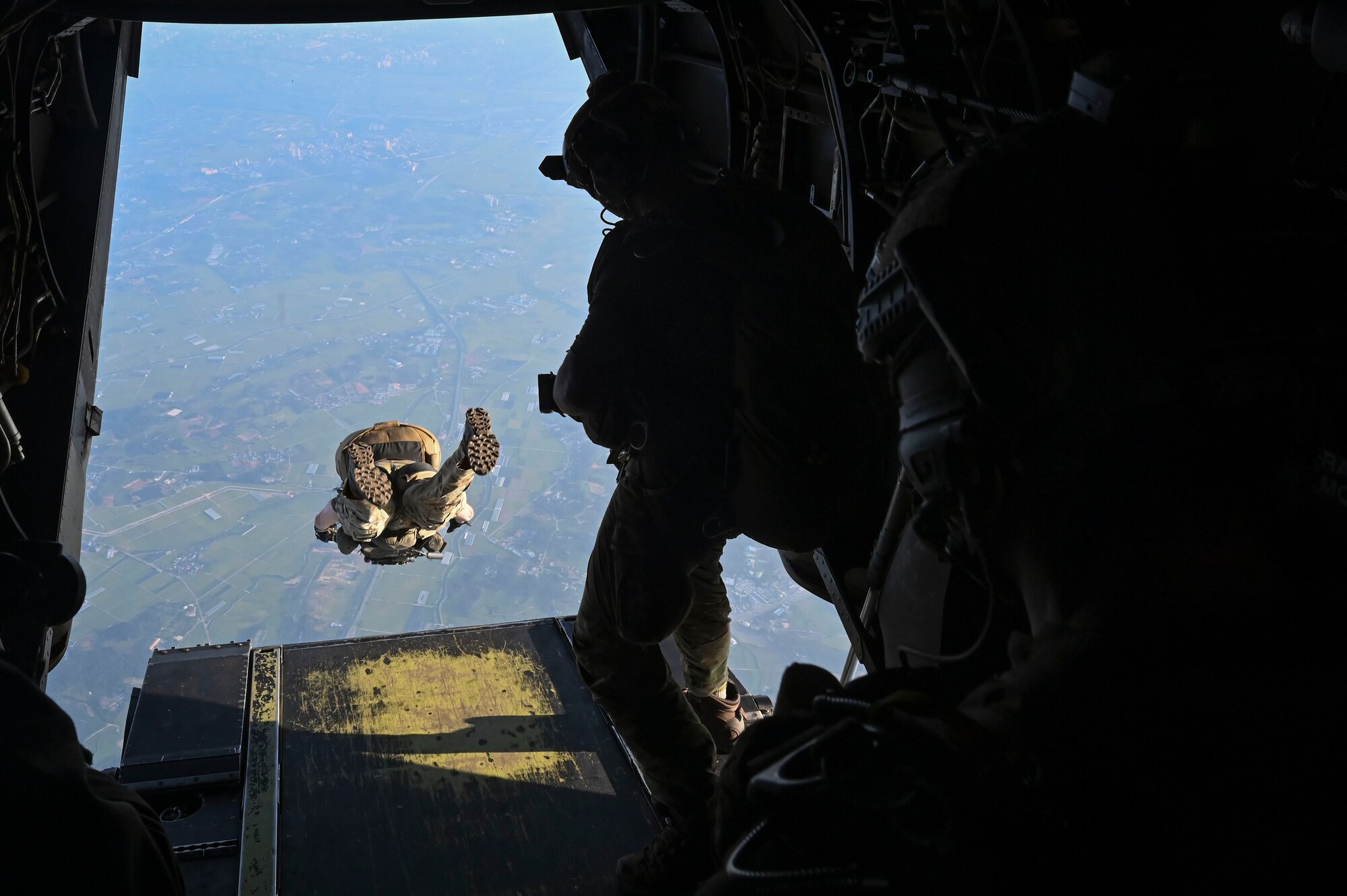 A U.S. special operations Soldier assigned to 1st Special Forces Group (Airborne) jumps off a U.S. Marine Corps MV-22B Osprey.