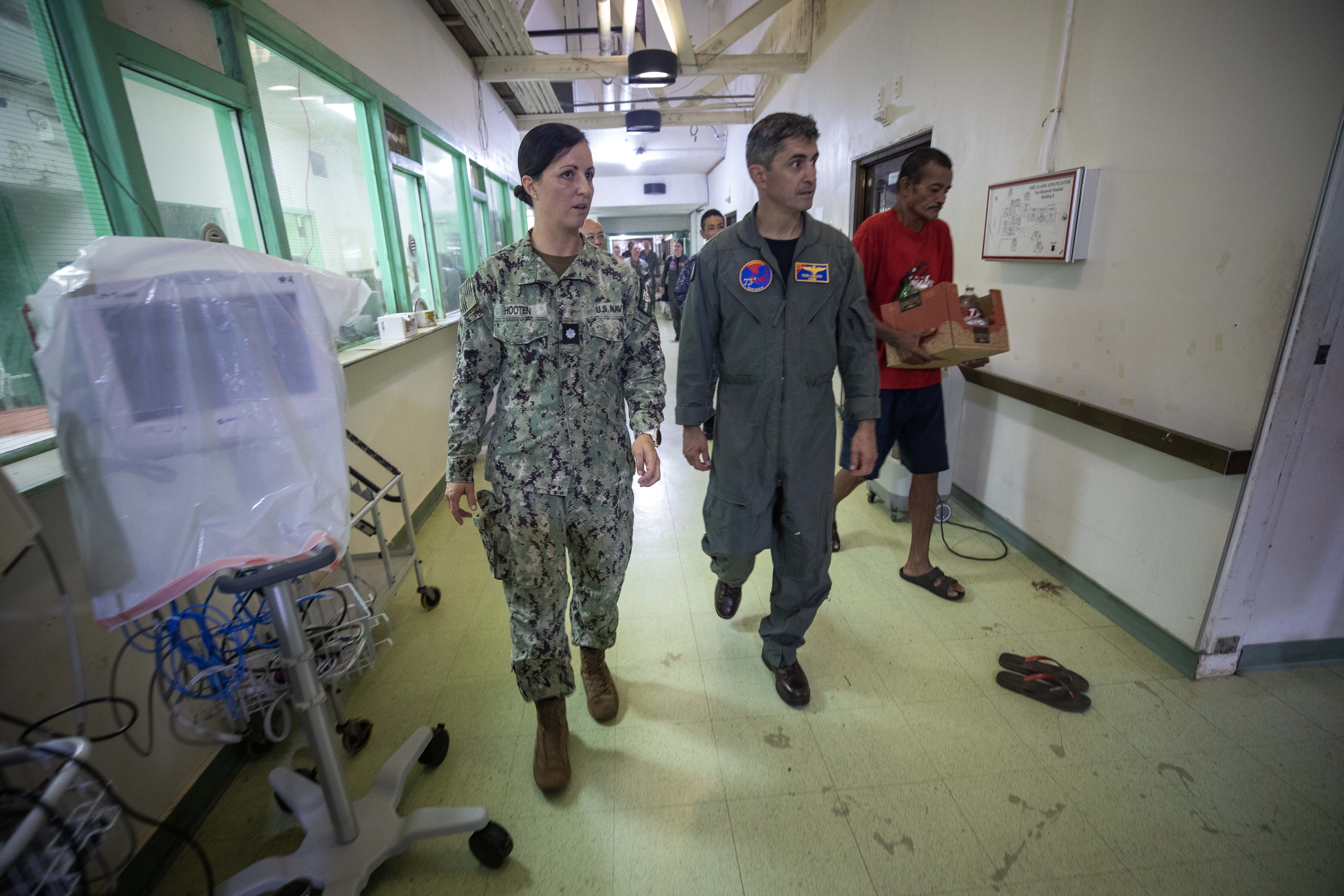 YAP, Federated States of Micronesia (Sept. 9, 2024) – U.S. Navy Cmdr. Hannah Hooten, Pacific Partnership 2024-2 (PP24-2) deputy director of medical operations and plans, gives a tour of Yap State Hospital to U.S. Navy Rear Adm. Todd Cimicata, commander, Logistics Group Western Pacific/Task Force 73, during a visit to observe the PP24-2 medical line of effort in Yap, Federated States of Micronesia, Sept. 9, 2024. Now in its 20th iteration, the Pacific Partnership series is the U.S. Navy’s largest annual multinational humanitarian assistance and disaster relief preparedness mission conducted in the Indo-Pacific. Pacific Partnership works collaboratively with host and partner nations to enhance regional interoperability and disaster response capabilities, increase security and stability in the region, and foster new and enduring friendships in the Indo-Pacific. (U.S. Navy photo by Mass Communication Specialist 1st Class Ryan D. McLearnon/Released)