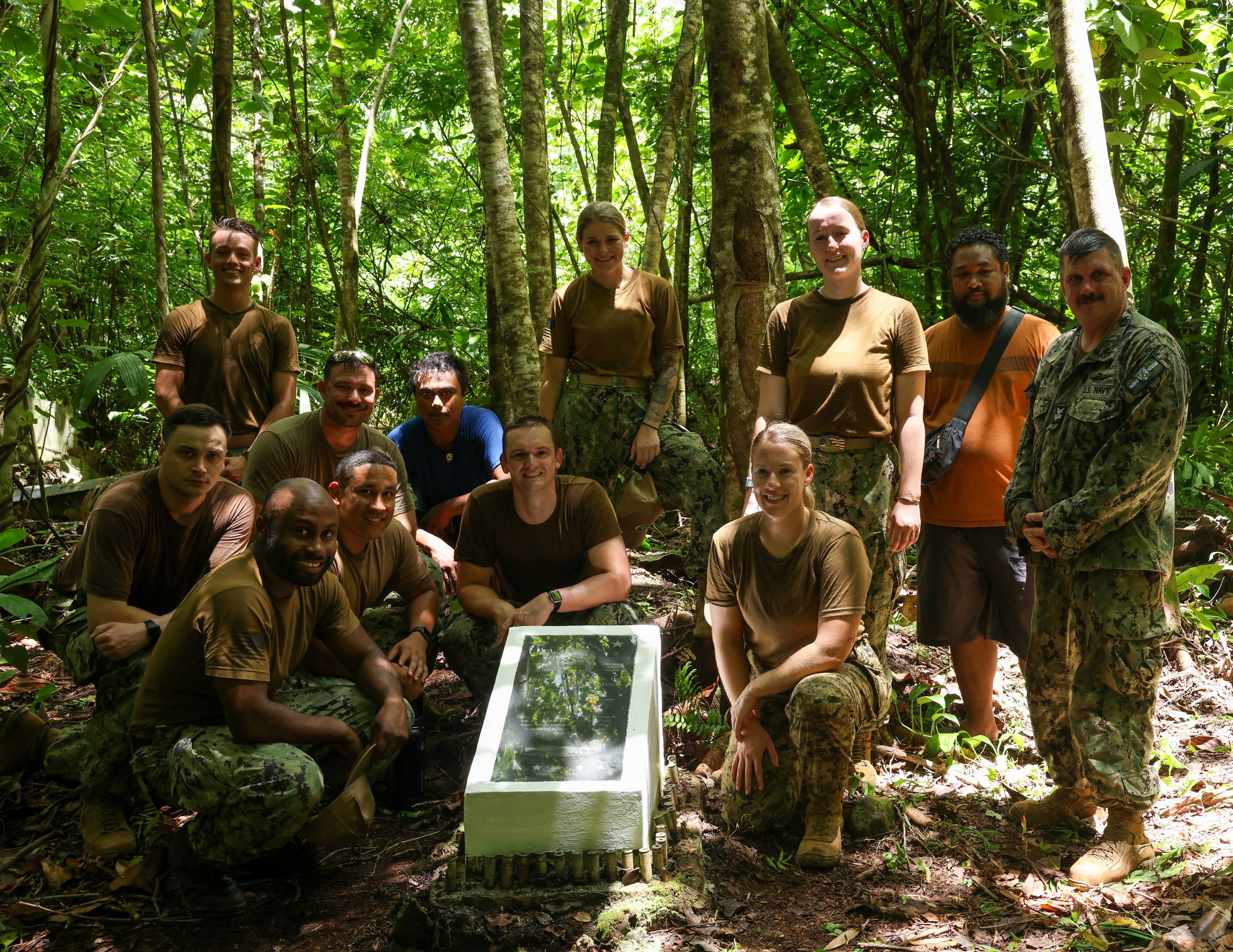 YAP, Federated States of Micronesia (Sept. 7, 2024) – U.S. Navy and Canadian Armed Forces service members deployed in support of Pacific Partnership 2024-2 take a group photo with locals at the plaque of a World War II memorial marker during a host nation outreach cleanup event with the Yap Visitors Bureau and members of the Yap Veterans Association, Sept. 7, 2024. The Pacific Partnership team assisted the Yap Visitors Bureau in the clean up of four of the known 19 World War II crash sites in Yap, Federated States of Micronesia. Now in its 20th iteration, the Pacific Partnership series is the U.S. Navy’s largest annual multinational humanitarian assistance and disaster relief preparedness mission conducted in the Indo-Pacific. Pacific Partnership works collaboratively with host and partner nations to enhance regional interoperability and disaster response capabilities, increase security and stability in the region, and foster new and enduring friendships in the Indo-Pacific. (U.S. Navy photo by Mass Communication Specialist Seaman Gavin Arnoldhendershot)