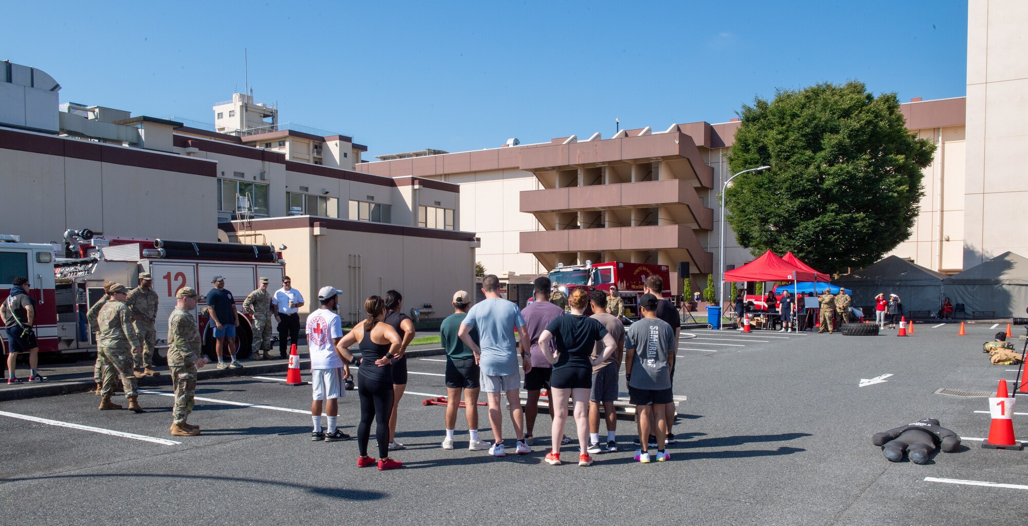 Participants gather as fire muster demonstrations are given.