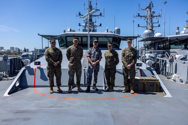 Royal Australian Navy Lt. Ian O’Niell, center, a psychologist with the HMAS Coonawara poses for a photo with U.S. Sailors with Marine Rotational Force – Darwin 24.3 aboard the ADV Cape Pillar at Larrakeyah Defence Precinct, NT, Australia, Sep. 2, 2024. Sailors received a tour of ADV Cape Pillar following an OPRES Resilience and BattleSMART brief to bring awareness to mental health in the military and ways to cope or get help for problems that occur. (U.S. Marine Corps photo by Cpl. Manuel Rivera)