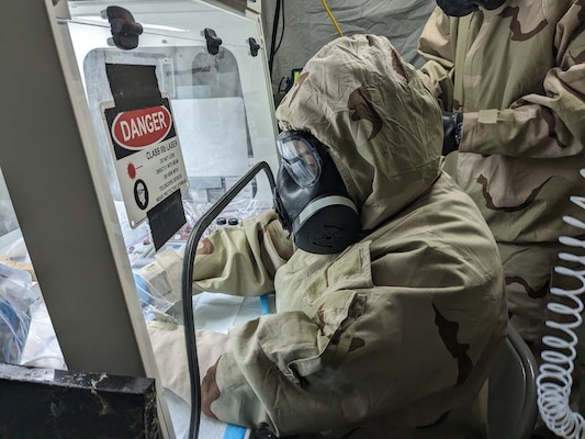 Chief Hospital Corpsman Colin Armstrong of Forward Deployable Preventive Medicine Unit (FDPMU) West attached to Navy Environmental Preventive Medicine Unit Five, conducts chemical analysis at the Naval Expeditionary Medical Training Institute, Camp Pendleton, CA. The FDPMU safeguards deployed service members' health, focusing on medical readiness and Force Health Protection. FDPMUs undergo nine-to-12-month training and an Operational Readiness Evaluation (ORE) before certification by Commander, Naval Medical Forces Atlantic. Once certified, they are always prepared for immediate action, with two teams on the watch at all times. They conduct chemical analysis during deployments to identify hazards and protect personnel. (U.S. Navy courtesy photo)