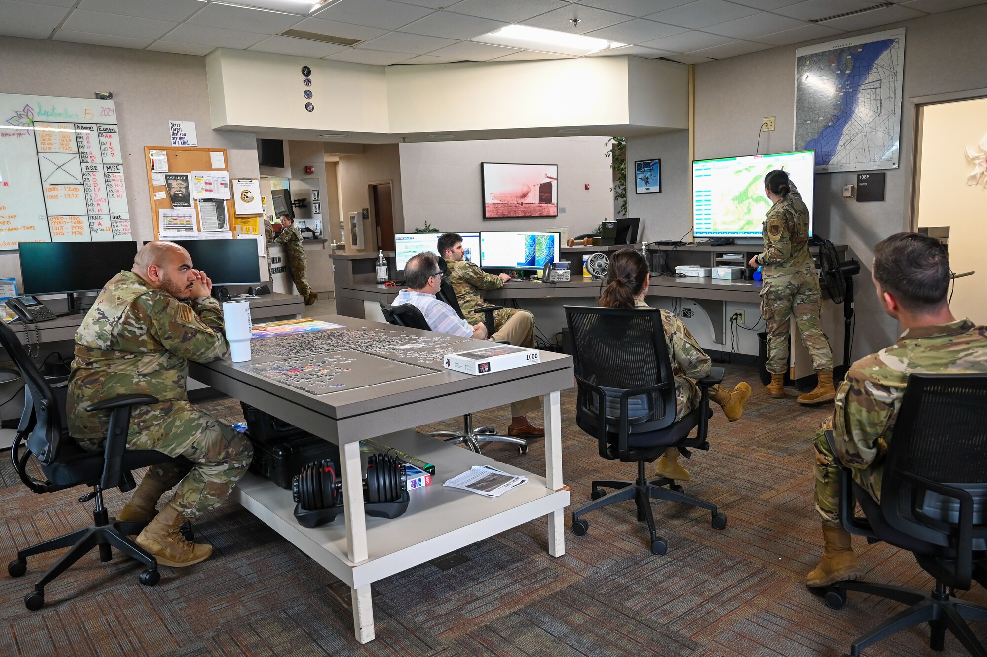Airmen are briefed about the weather.