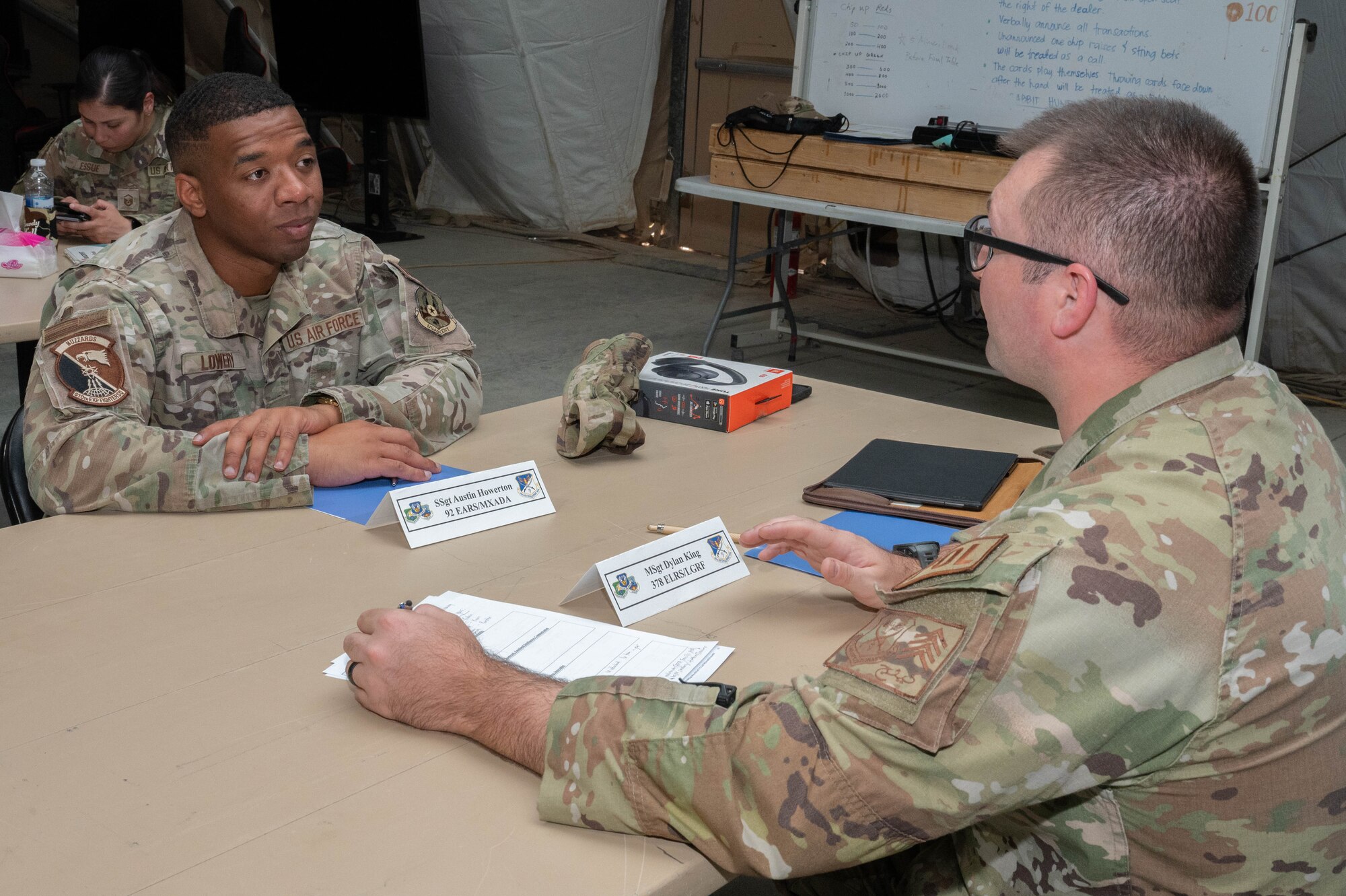 A U.S. Air Force noncommissioned officer receives feedback from a Senior NCO during the wing’s first-ever peer-led records review focused on developing noncommissioned officers within the U.S. Central Command area of responsibility, August 29, 2024. The event helped develop NCOs and support their roles as frontline supervisors. (U.S. Air Force photo)