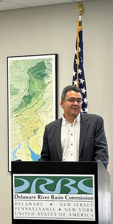 Leader speaks at a podium during an event.