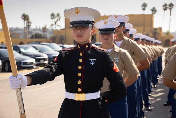 New U.S. Marine Corps Lance Cpl. Mary McGrath, honor graduate with Charlie Company, 1st Recruit Training Battalion, stands in formation prior to a graduation ceremony at Marine Corps Recruit Depot San Diego, California, Sept. 13, 2024. This ceremony marked the end of a 13-week transformation that included training in drill, marksmanship, basic combat skills, and Marine Corps customs and traditions. (U.S. Marine Corps photo by Lance Cpl. Janell B. Alvarez)