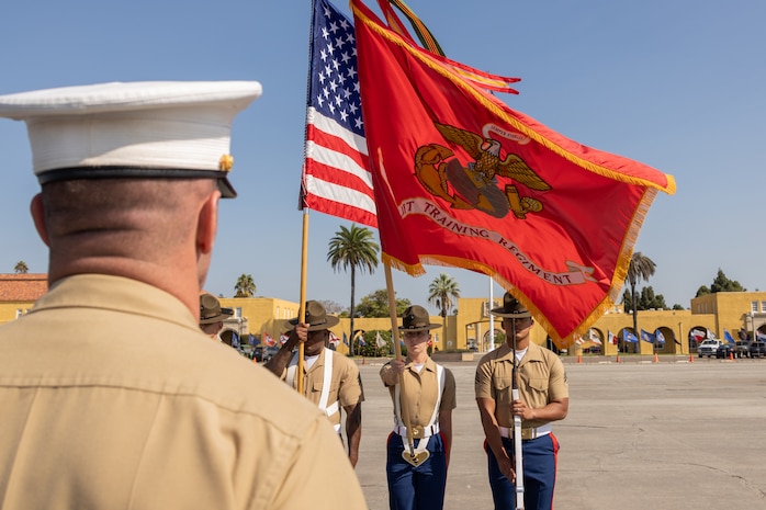 U.S. Marines assigned to the Recruit Training Regiment Color Guard, Marine Corps Recruit Depot San Diego, present the colors during the Alpha Company, 1st Recruit Training Battalion graduation ceremony at MCRD San Diego, California, Aug. 16, 2024.  This ceremony marked the end of a 13-week transformation that included training in drill, marksmanship, basic combat skills, and Marine Corps customs and traditions. (U.S. Marine Corps photo by Lance Cpl. Janell B. Alvarez)