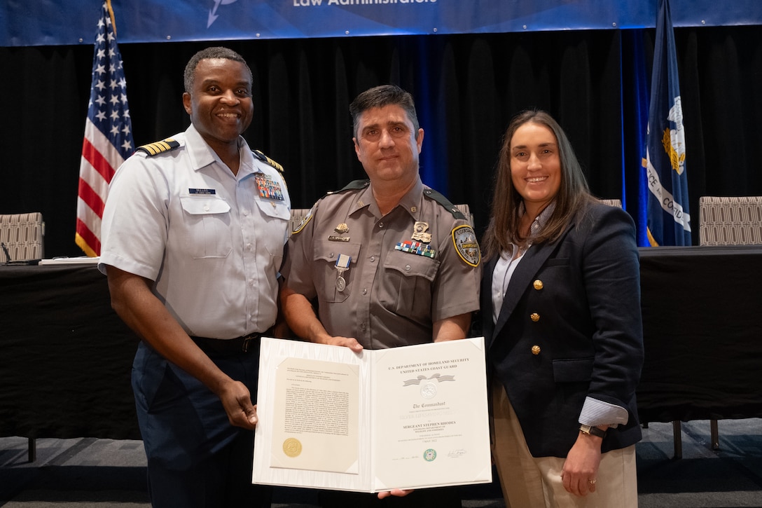 Capt. Ulysses Mullins, Coast Guard Eighth District Chief of Staff, presented Louisiana Department of Wildlife and Fisheries’ Sgt. Stephen Rhodes with the Coast Guard Silver Lifesaving Medal, Tuesday, Sept. 17, in New Orleans. Sgt. Rhodes received the medal in recognition of his heroic actions on May 7, 2022 when he saved the lives of nine people after their vessel capsized in rough water near Grand Isle, Louisiana. (U.S. Coast Guard photo by Petty Officer 3rd Class Jaiden Hartley)