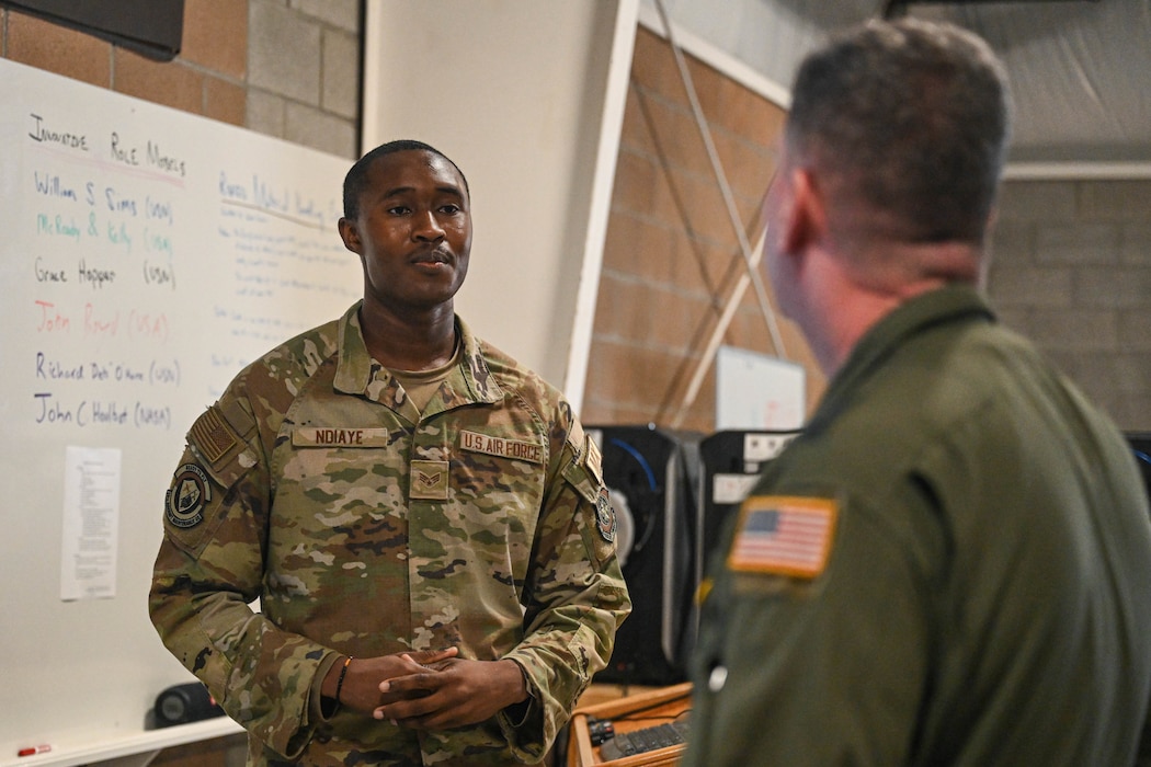 Airmen speak to each other.