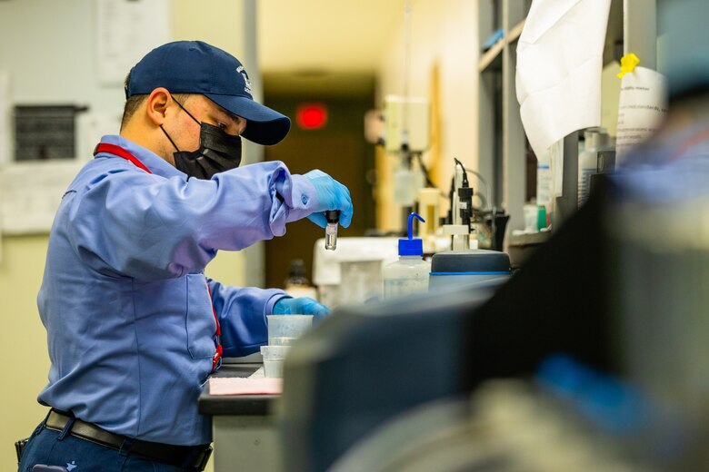 Water Treatment Operator Eli Bermudez conducts a test on a water sample while working on the third shift at the Dalecarlia Water Treatment Plant Dec. 15, 2020. (USACE photo by Christopher Fincham)