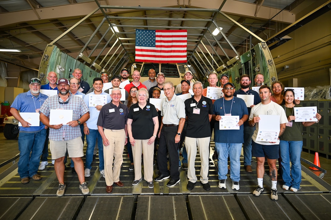 Employer Support of the Guard and Reserve volunteers and civilian employers of Alamo Wing Reserve Citizen airmen pose for a photo with their statement of support during the “Bosslift” event Sept. 14, 2024, at Joint Base San Antonio-Lackland, Texas.