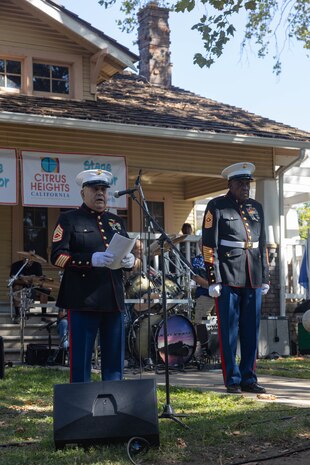 U.S. Marine Corps Gunnery Sgt. Paul Reyes (retired), left, a member of American Legion Post 637, gives remarks during the Sgt. Nicole Gee Memorial ceremony in Citrus Heights, California, Sept. 14, 2024. A memorial and celebration of life for Gee was held by the American Legion Post 637. During the ceremony, a memorial park bench was unveiled in honor of Gee. (U.S. Marine Corps photo by Staff Sgt. Ryan Harvey)