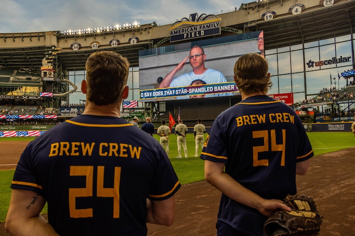 U.S. Marines with Recruiting Station Milwaukee present the national ensign and organizational colors during the opening ceremony of a Milwaukee Brewers game at American Family Field in Milwaukee, Wisc., Sept. 16, 2024. Marines from Recruiting Station Milwaukee were invited by the Brewers to participate during the opening ceremony of a game against the Philadelphia Phillies. (U.S. Marine Corps photo by Cpl. Collette Hagen)
