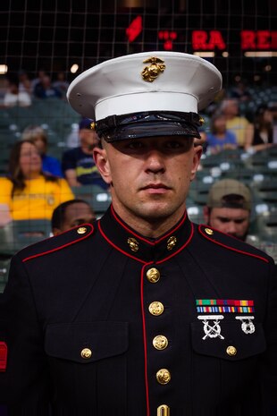 U.S. Marine Corps Sgt. Joseph Kasprzak, a production recruiter with Recruiting Sub-Station North Milwaukee, stands in formation before the opening ceremony of a Milwaukee Brewers game at American Family Field in Milwaukee, Wisc., Sept. 16, 2024. Marines from Recruiting Station Milwaukee were invited by the Brewers to present the national ensign and organizational colors during the opening ceremony of a game against the Philadelphia Phillies. (U.S. Marine Corps photo by Cpl. Collette Hagen)