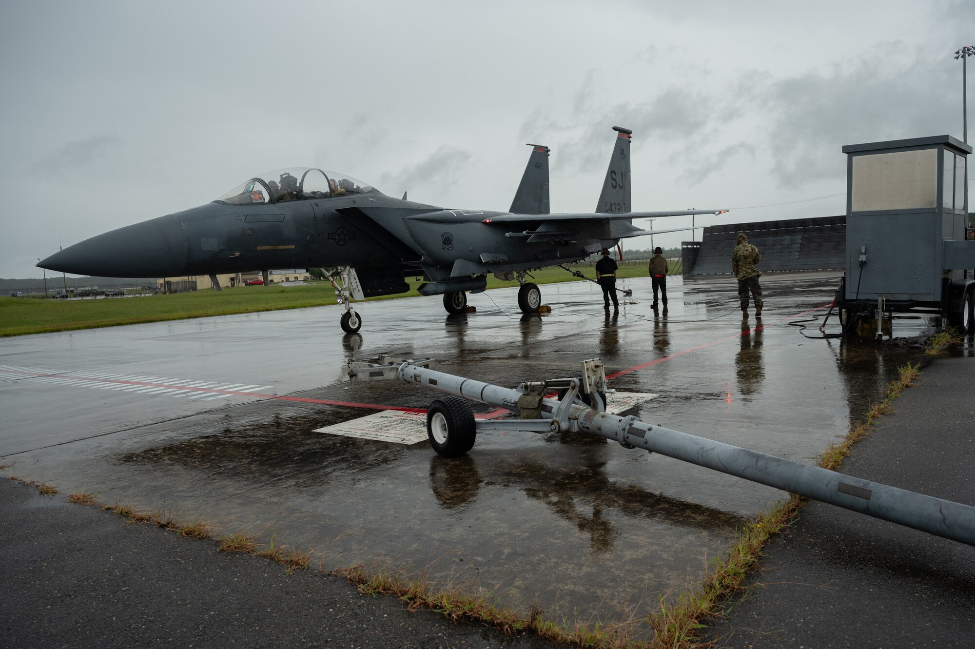 U.S. Air Force aircrew assigned to the 4th Maintenance Squadron perform an engine run on an F-15E Strike Eagle at Seymour Johnson Air Force, North Carolina, Sept. 13, 2024. Engine runs are conducted to verify all systems are functional, operating correctly and ensure the jet is in top condition. (U.S. Air Force photo by Senior Airman Rebecca Sirimarco-Lang)