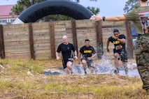 Almost 700 participants showed up Sept. 14, 2024 to challenge their physical abilities to overcome and adapt to numerous obstacles on a four-mile course on Fort Eisenhower, Ga. as part of the Marine Mud Challenge.