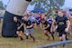 Soldiers run through an obstacle of the Marine Mud Challenge. Almost 700 participants showed up Sept. 14, 2024 to challenge their physical abilities to overcome and adapt to numerous obstacles on a four-mile course on Fort Eisenhower, Ga. as part of the Marine Mud Challenge.