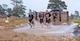 Soldiers run through an obstacle of the Marine Mud Challenge. Almost 700 participants showed up Sept. 14, 2024 to challenge their physical abilities to overcome and adapt to numerous obstacles on a four-mile course on Fort Eisenhower, Ga. as part of the Marine Mud Challenge.