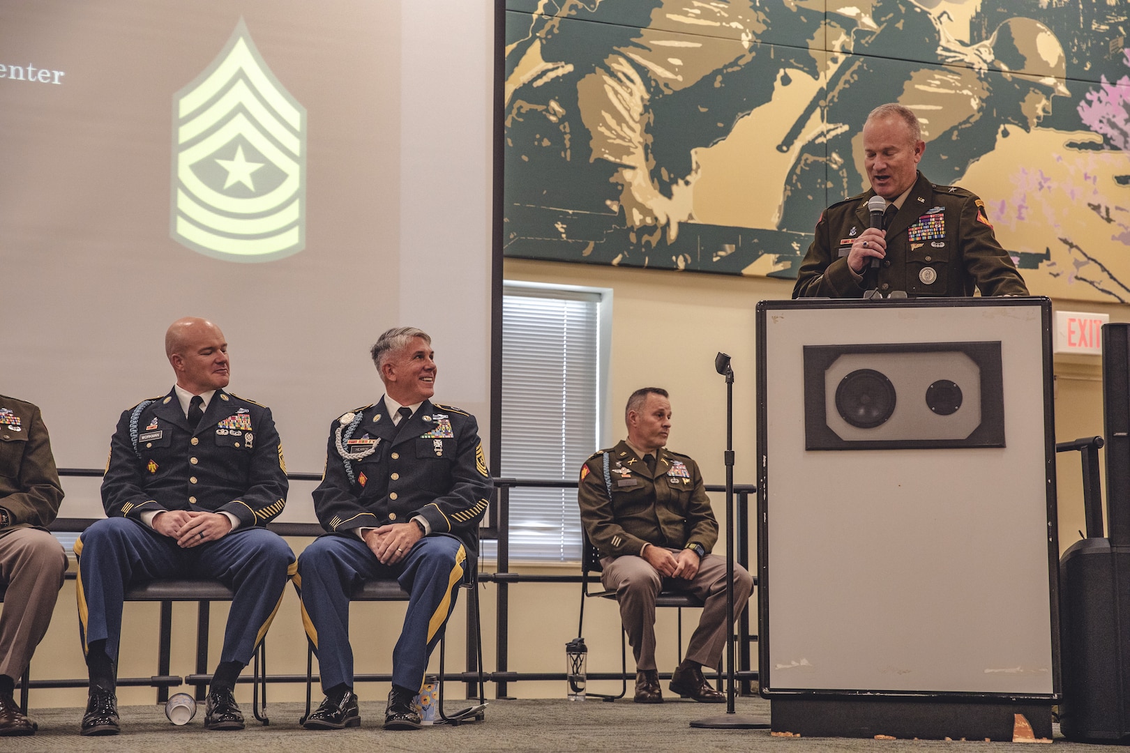 Brig. Gen. Colby Wyatt, director of the joint staff for the Oklahoma National Guard, speaks during a joint retirement ceremony for Command Sgt. Maj. John Workman of Glenpool, Oklahoma and Sgt. Maj. Michael Hearon of Mead, Oklahoma, both members of 1st Battalion, 179th Infantry Regiment, 45th Infantry Brigade Combat Team, held at the Norman Armed Forces Reserve Center in Norman, Oklahoma, Saturday, Sept. 14, 2024. Together Workman and Hearon have a combined 61 years of service, including their final assignment as members of the command team for Task Force Tomahawk during their deployment to the Horn of Africa from 2023-2024. (Oklahoma National Guard photo by Staff Sgt. Reece Heck)