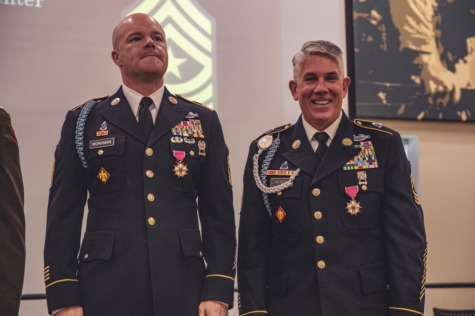 Oklahoma Army National Guardsmen Command Sgt. Maj. John Workman (Left) of Glenpool, Oklahoma and Sgt. Maj. Michael Hearon (Right) of Mead, Oklahoma, both members of 1st Battalion, 179th Infantry Regiment, 45th Infantry Brigade Combat Team, celebrate their joint retirement during a ceremony held at the Norman Armed Forces Reserve Center in Norman, Oklahoma, Saturday, Sept. 14, 2024. Together Workman and Hearon have a combined 61 years of service, including their final assignment as members of the command team for Task Force Tomahawk during their deployment to the Horn of Africa from 2023-2024. (Oklahoma National Guard photo by Staff Sgt. Reece Heck)