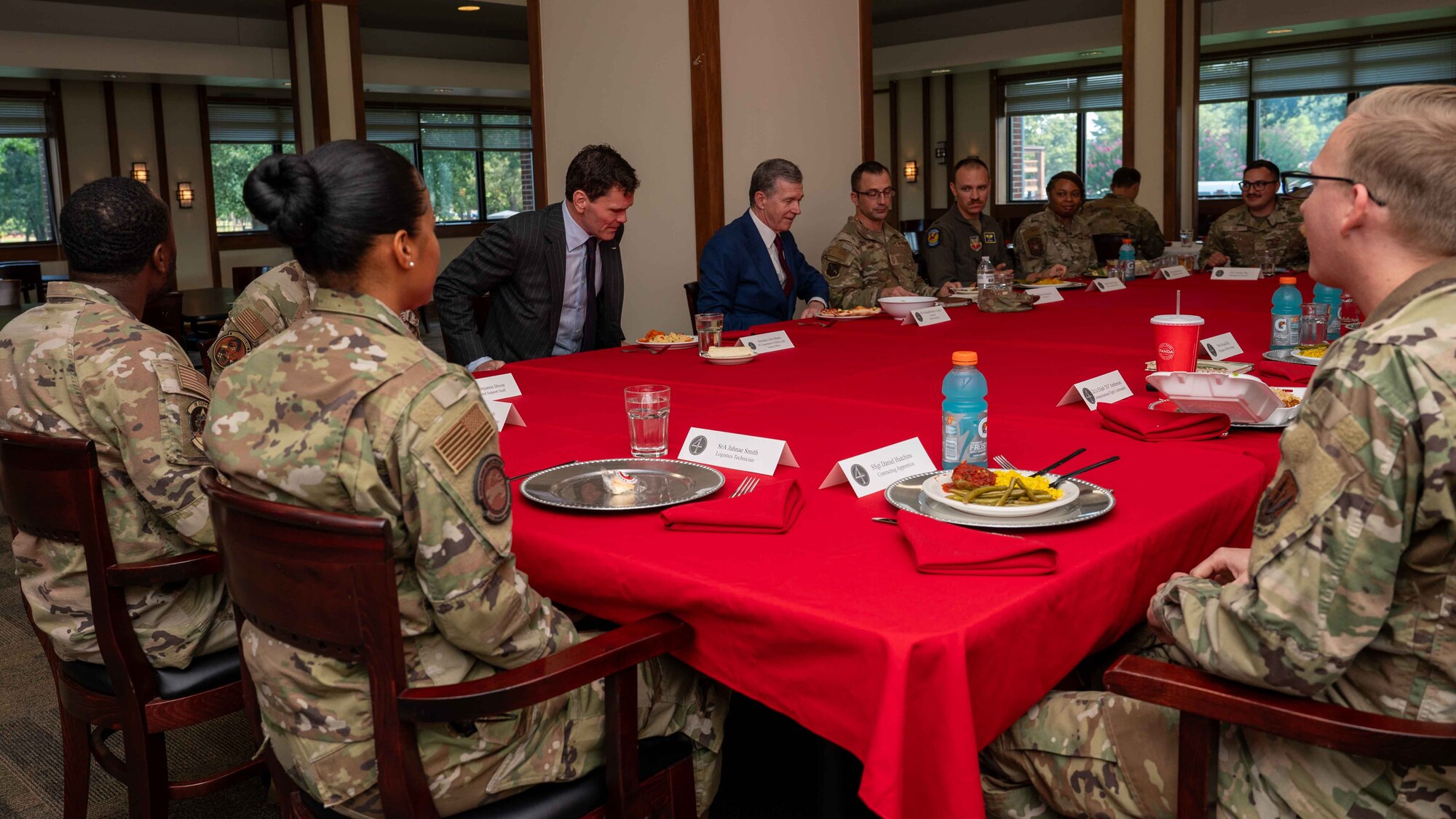 Governor Roy Cooper, Governor of North Carolina, enjoys a meal with Airmen at the Southern Eagle Dining Facility during a congressional delegate visit to Seymour Johnson Air Force Base, North Carolina, Aug. 29, 2024. Cooper received a brief regarding topics such as quality of life for Airmen, childcare, and much more. (U.S. Air Force photo by Airman 1st Class Rebecca Tierney)