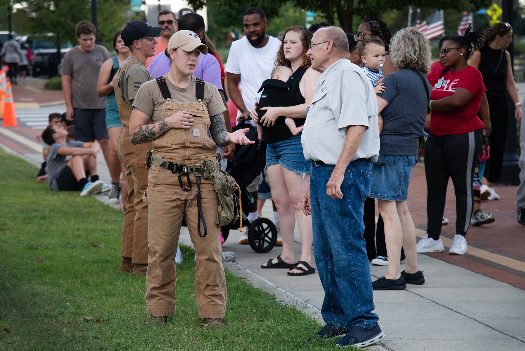 SSgt Briana Irven, 4th SFS military working dog handler, talks to community members during the NC Freedom Fest 2024.