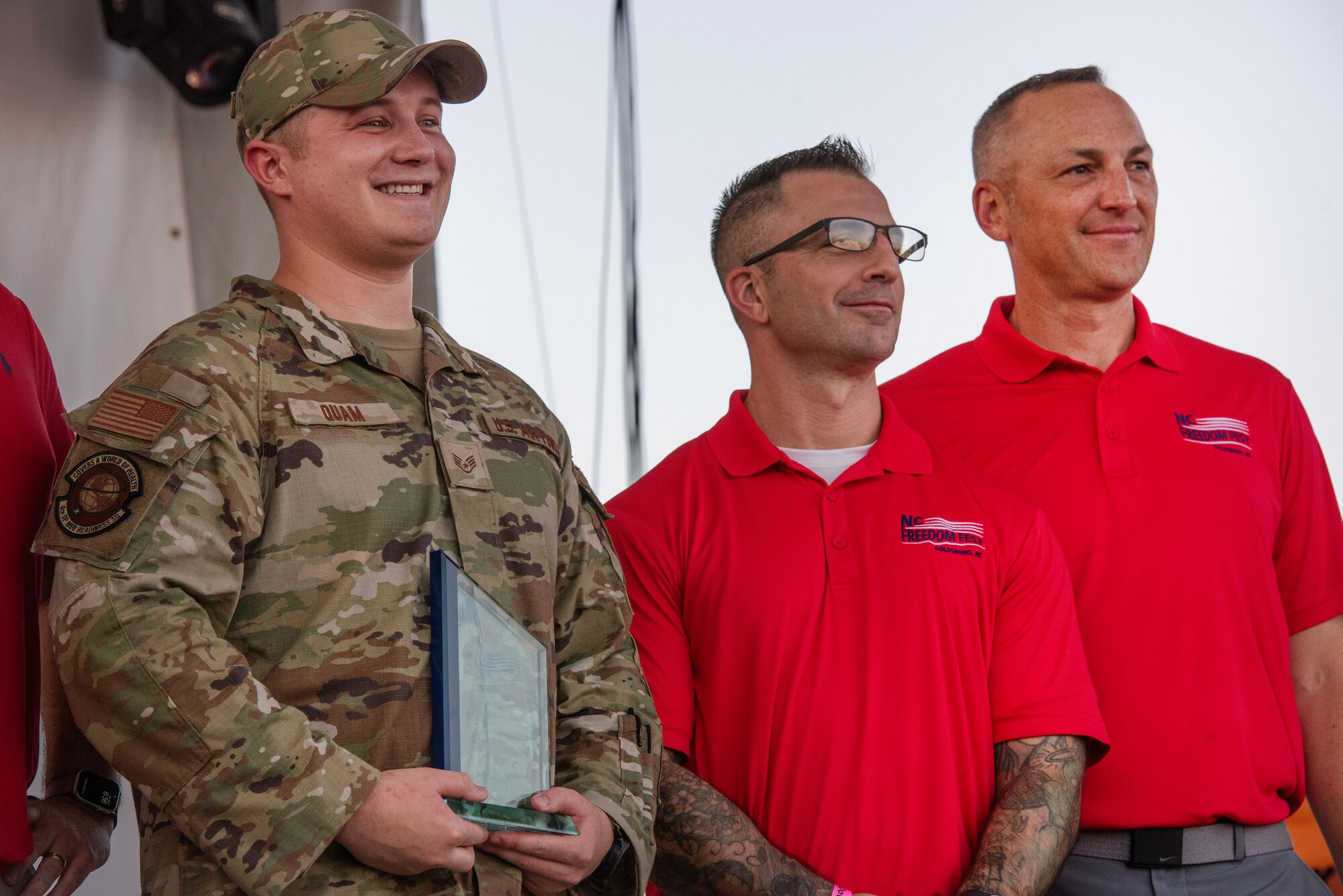 SSgt Aspen Quam, left, 4th OMRS, accepts the Airman of the Year Military Appreciation Award during the NC Freedom Fest 2024.