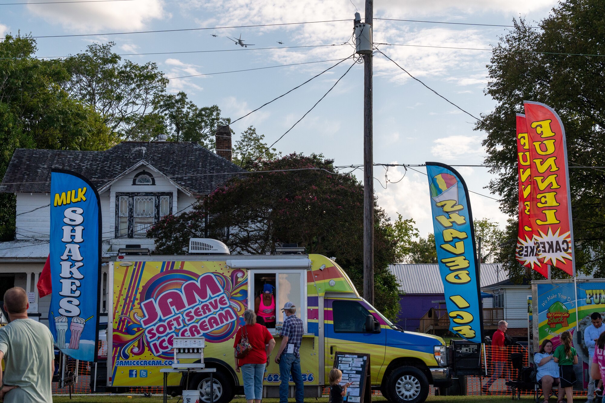 Spectators watch a three-ship flyover during the NC Freedom Fest 2024.