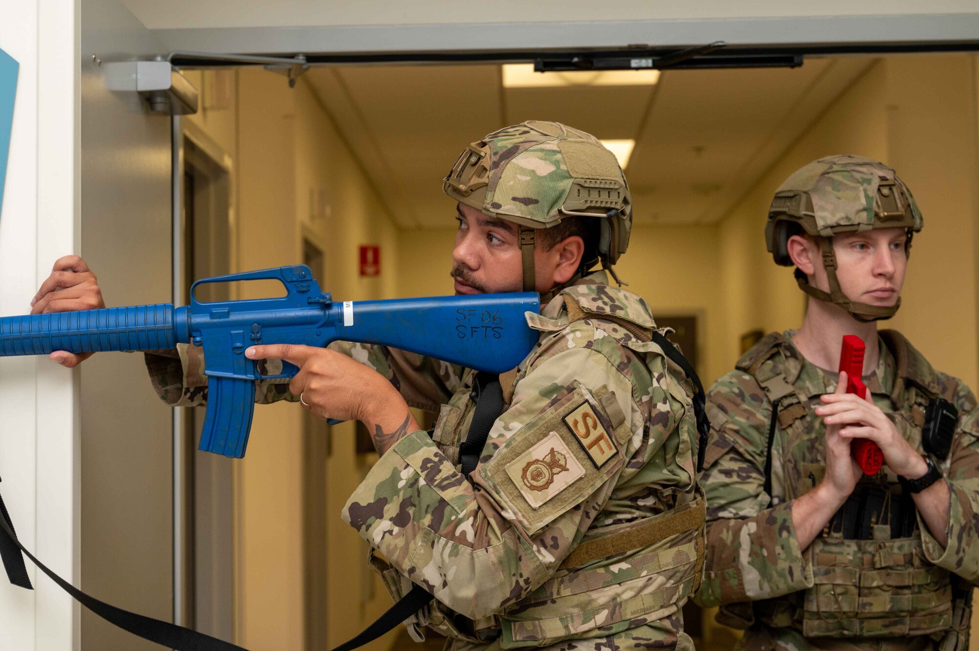 U.S. Air Force Master Sgt. Tyler Dudley, left, 4th Security Forces Squadron flight chief, and Senior Airman Evan Rhiel, 4th Security Forces Squadron armorer, respond to an active shooter exercise at Seymour Johnson Air Force Base, North Carolina, Sept. 4, 2024. This exercise allows for different agencies across base to maintain preparedness in the event of a real-world scenario. (U.S. Air Force photo by Airman 1st Class Rebecca Tierney)
