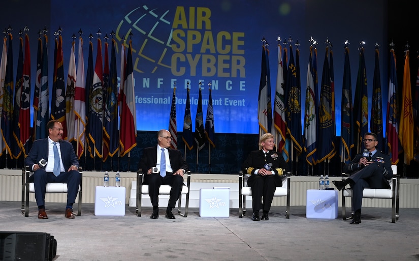 Navy Rear Adm. Heidi Berg (second from right), deputy commander, Fleet Cyber Command and deputy commander, Navy Space Command, and Air Marshal Paul Godfrey (right), assistant chief of Space Operations for Future Concepts and Partnerships, participate in a panel at the Air, Space and Cyber Conference in National Harbor, Md., Sept 16, 2024. The technology exposition brings together Air Force leadership, industry experts, academia as well as aerospace and cyberspace specialists from around the world to discuss the issues and challenges facing America today. (U.S. Air Force photo by Chad Trujillo)